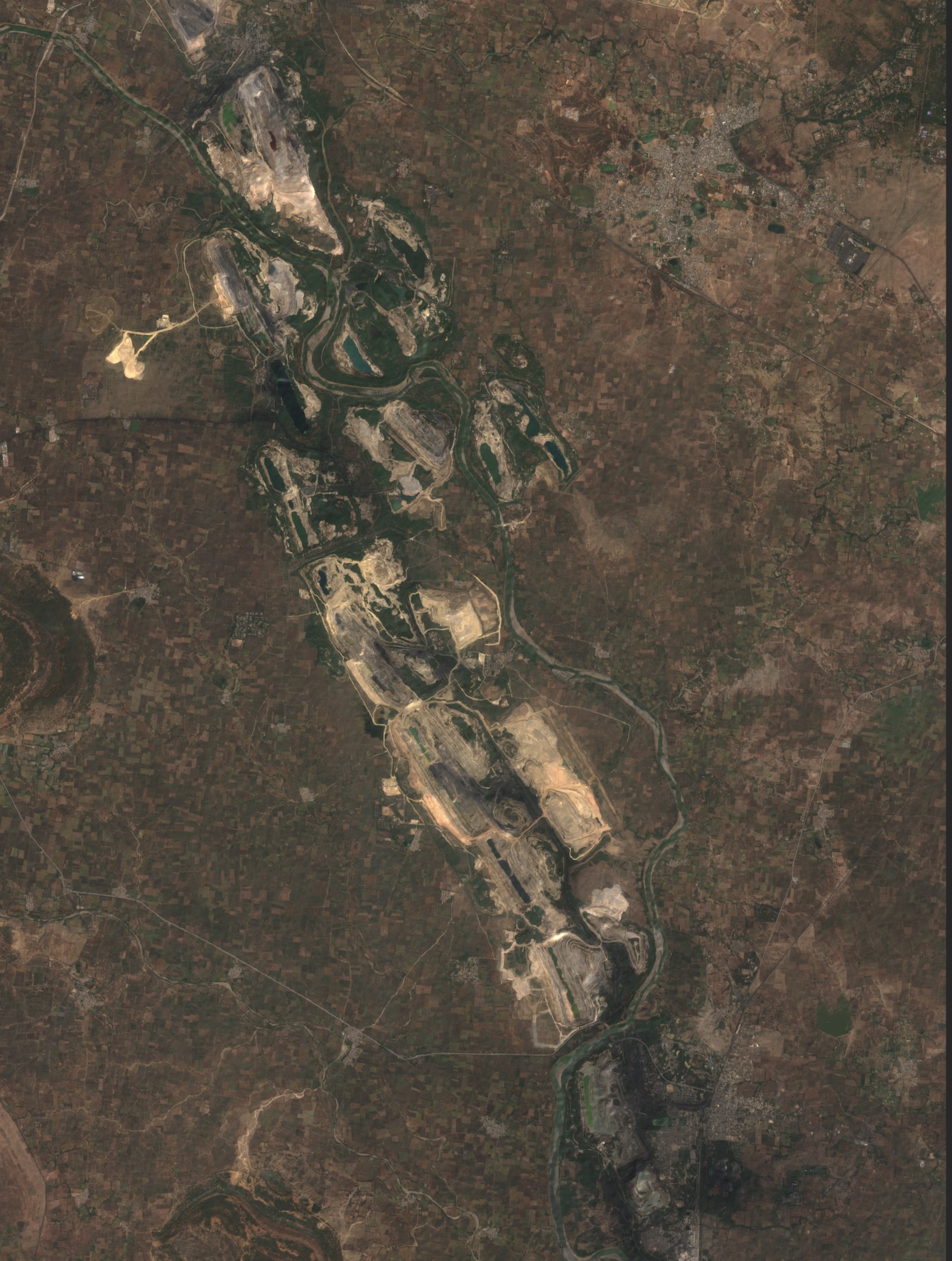 Wide-area satellite image of a mining complex
